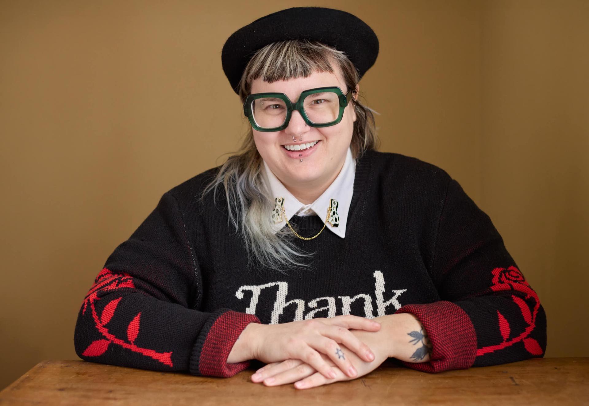 Creative headshot of a Ferndale professional in a beret and green glasses by Judy Babinski Photography